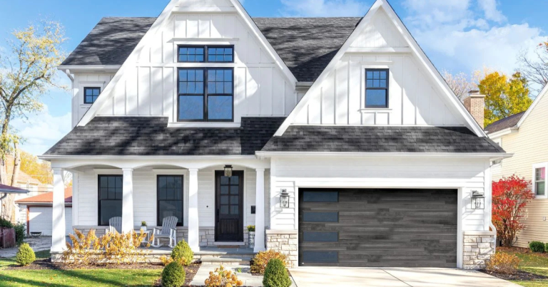 black garage doors on white house